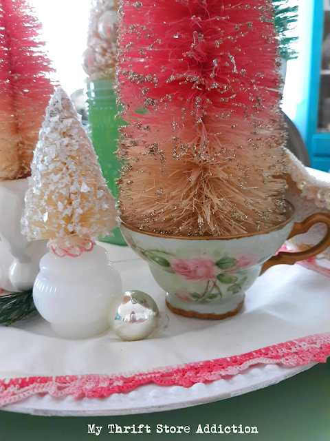 Gather your thrift store treasures and some bottle brush trees to create a lovely vintage centerpiece in less than 15 minutes! simple vintage decor