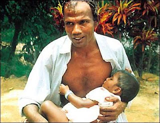 A man breast feeds his child