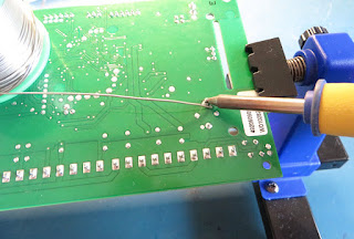 Flooding capacitor pins with solder