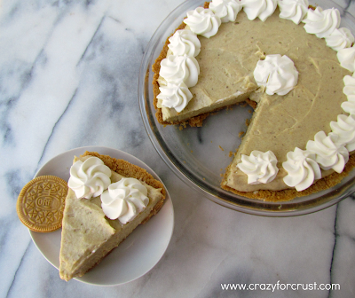 Banana cream pie with golden oreo crust with one slice removed