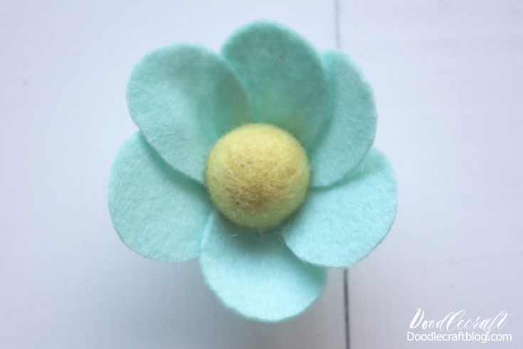 Step 3: How to Make a Felt Flower Now Let's Make a Large Petal Flower For the next flower, cut 6 felt circles and hot glue them around a felt ball to make the perfect flower. The petals overlap just slightly and give it a natural look.