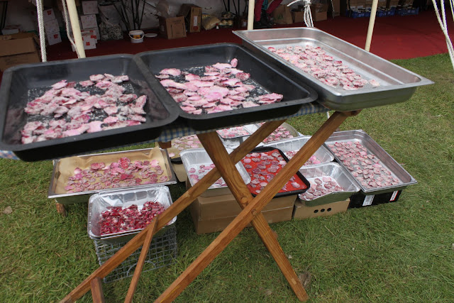  There is no end to the use of this ironing board. Drying rose petals in the sun.