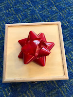 box with red bow