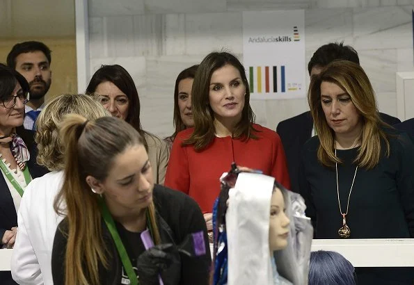 Queen Letizia wore Zara frilled sleeve coat and wore Lodi Saray Pumps, she carried Carolina Herrera red python clutch at AndalucíaSkills event