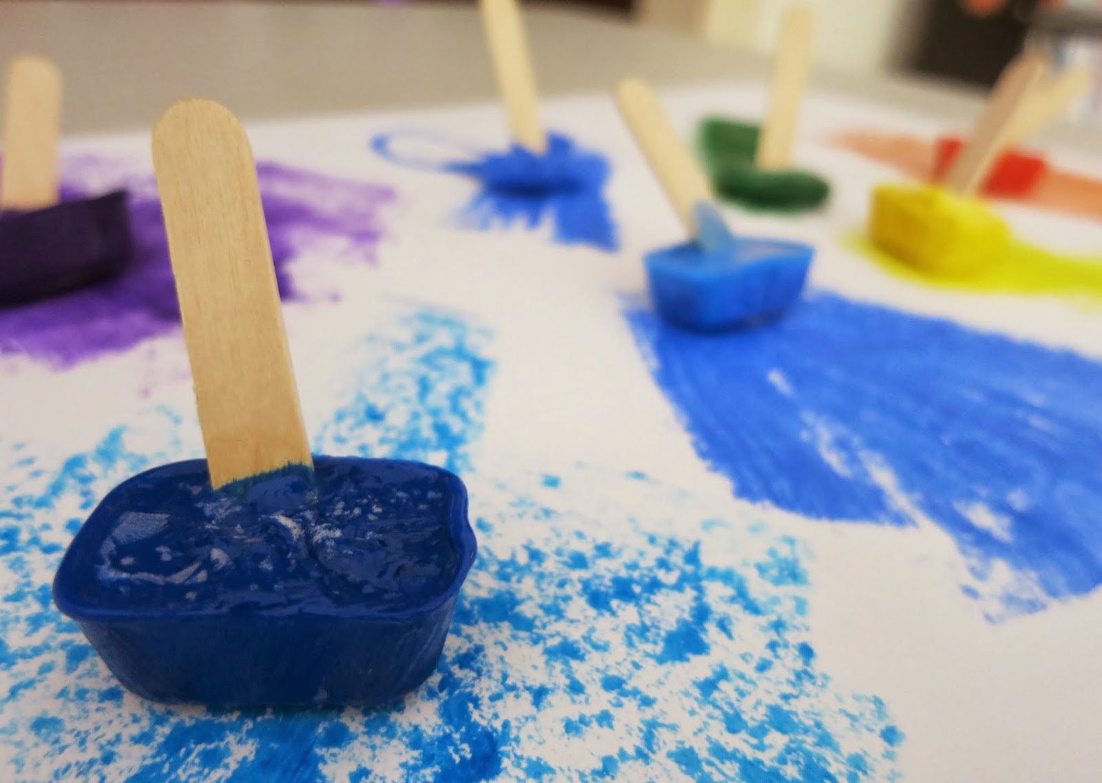 Learn with Play at Home Paintsicles. Frozen paint cubes for creative fun.