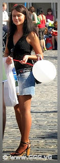 Smiling girl in jean skirt on the street