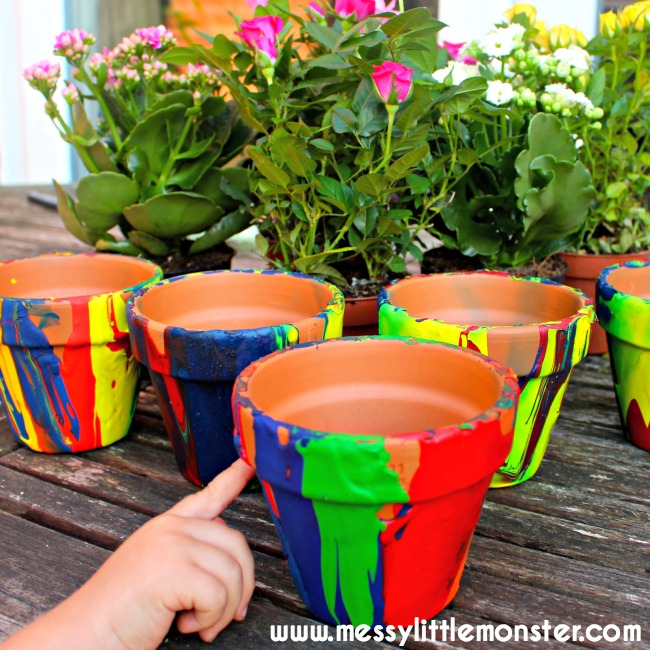 Easy art idea for kids. DIY pour painting flower pots use a fun painting technique. This rainbow craft makes a perfect Mothers Day or teacher kid made gift.