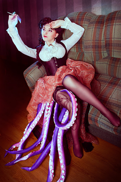 Victorian Steampunk Octopod Cosplay. Woman wearing corset, skirt, blouse and octopus tentacles. Steampunk fashion inspiration