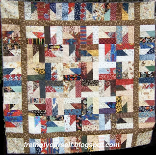 Western-themed fabric is used to create a baby quilt in red, black, brown, blue, tan and white.