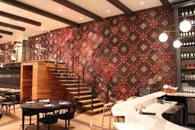 Restaurant with chunky cross stitch wall installation