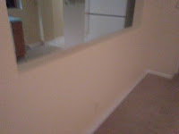 Repaired drywall on half wall and painted room.