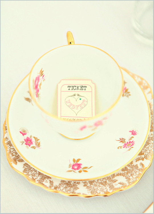 pink and gold vintage teacup on gold plate