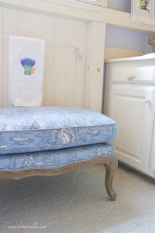 French Country Style for Bathrooms begins with a small toile bench