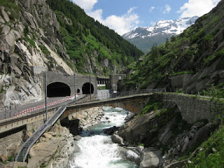 Auto, pedestrian, and train passages through a tunnel at the Schöllenen Gorge, Switzerland