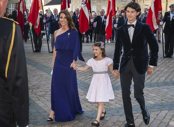 Crown Princess Mary wore a gown by Jesper Høvring. Princess Marie wore a gown by Rikke Gudnitz. Princess Isabella, Princess Alexandra