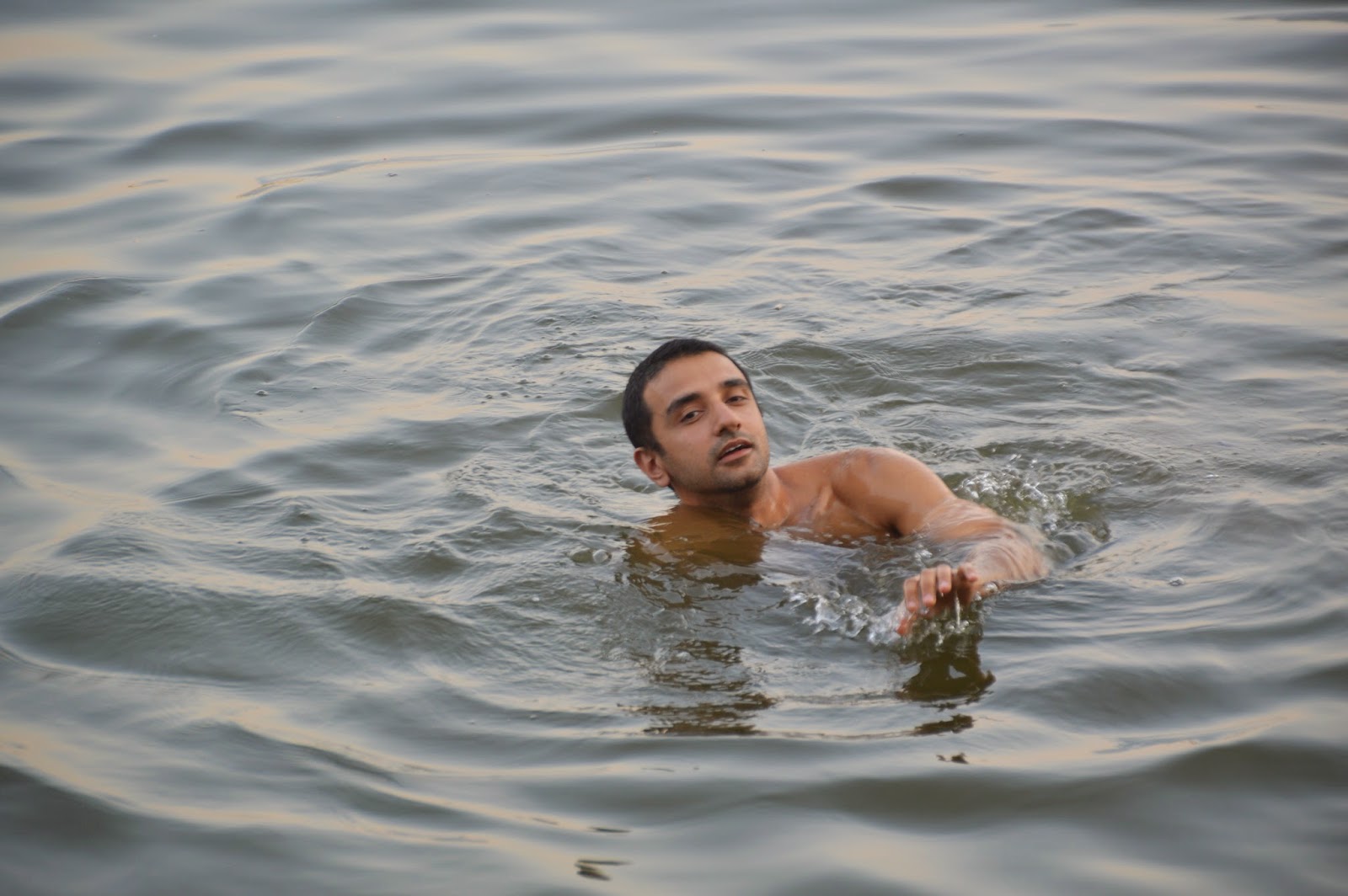 Varanasi Things to do morning swimming indian naked man male swimming ghat