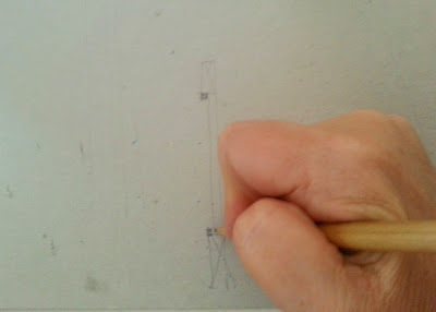 Person drawing a diagram of how windows are built.
