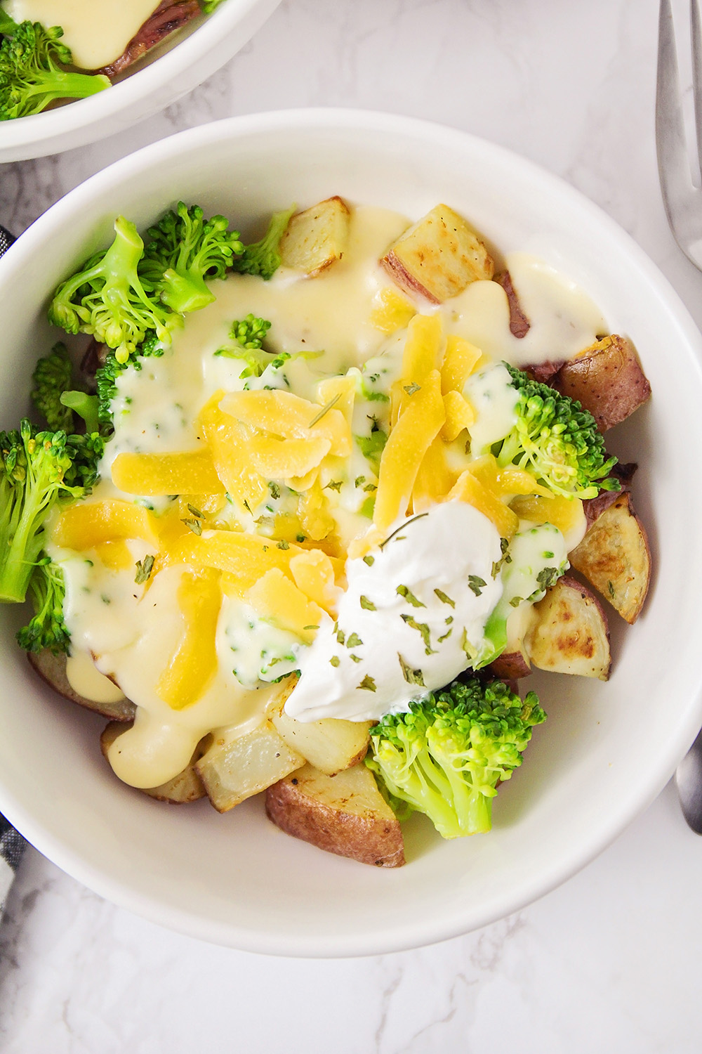 These cheesy broccoli potato bowls are a delicious meatless meal that's easy to make and perfect for a busy weeknight!