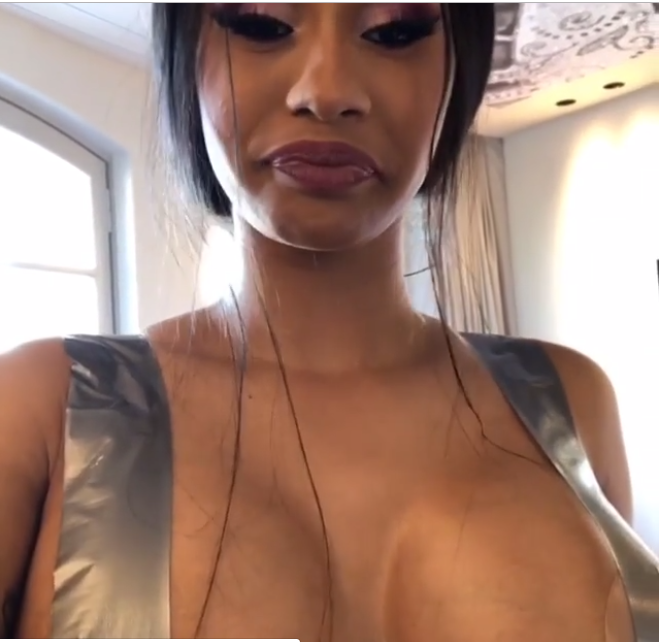 Sharing a video of herself with her boobs taped up... 