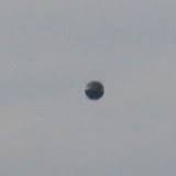 Metallic Ball Shaped UFO hovering in sky over Upminster GB 8/30/16