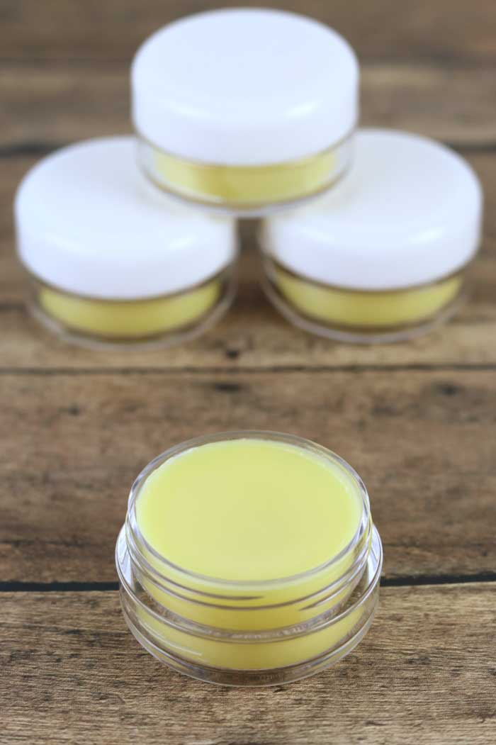 How to make DIY dandelion lip balm.  Use dandelion infused oil for the best homemade lip balm recipe.  This lip balm recipe has shea butter and beeswax to moisturize dry lips.  Home made lip balm with just three ingredients.  Make a natural lip balm recipe for dry or chapped lips.  Natural lip balm without yucky ingredients.  #lipbalm #dandelion