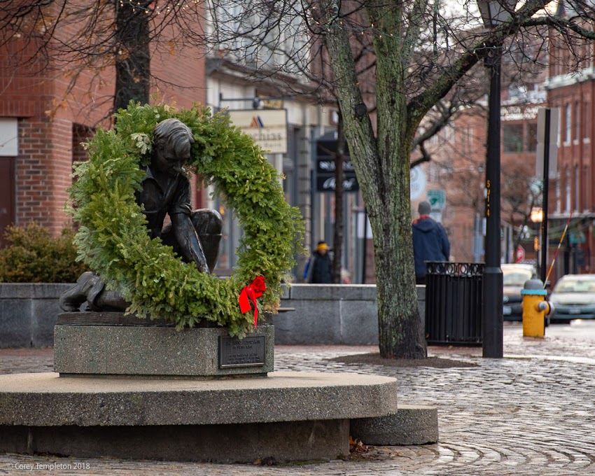 Portland, Maine USA December 2018 photo by Corey Templeton. The Maine Lobsterman statue by Victor Cahill, with some holiday decor. 