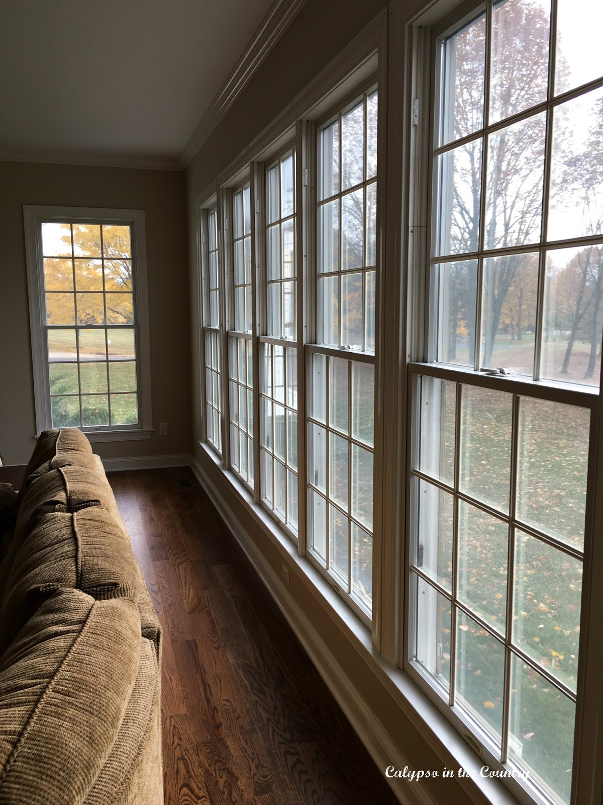 Wall of Windows in Family Room before Plantation Shutters installed