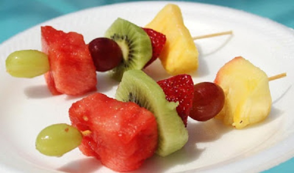 This is grilled fruit kabob for a barbecue in the backyard. The fruits are pineapple, cherry, strawberry with a coconut rum sauce. This is an easy dessert for the grill and great idea for a quick and easy dessert for any backyard family picnic food