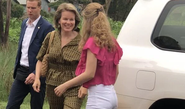 Queen Mathilde Dries Van Noten jacket and trousers, Natan dress, Crown Princess Elizabeth in Maje blouse and white trousers