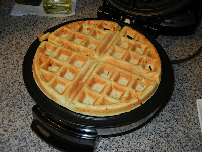 cooked waffle in a waffle iron 