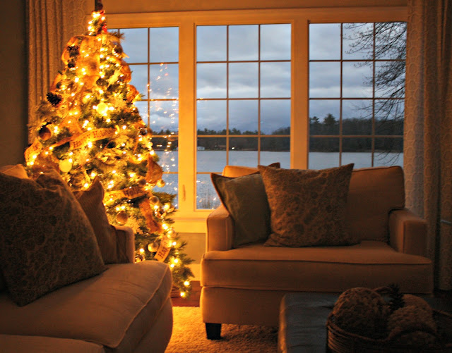 A living room filled with furniture and a large window