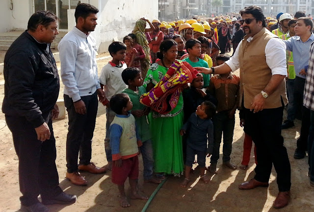 Mr Arman Chaudhary,Chief of HR,Emaar India at the Clothes Distribution Drive for labourers at Palm Terraces Gurugram Mr Arman Chaudhary,Chief of HR,Emaar India at the Clothes Distribution Drive for labourers at Palm Terraces Gurugram