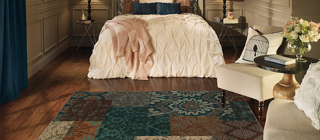 An area rug sets this bedroom sitting area apart.