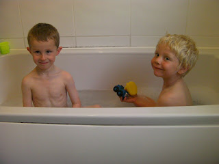2 boys in a bath