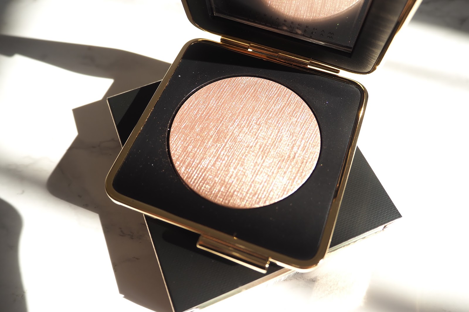 Victoria Beckham X Estée Lauder Makeup a little pop of coral.