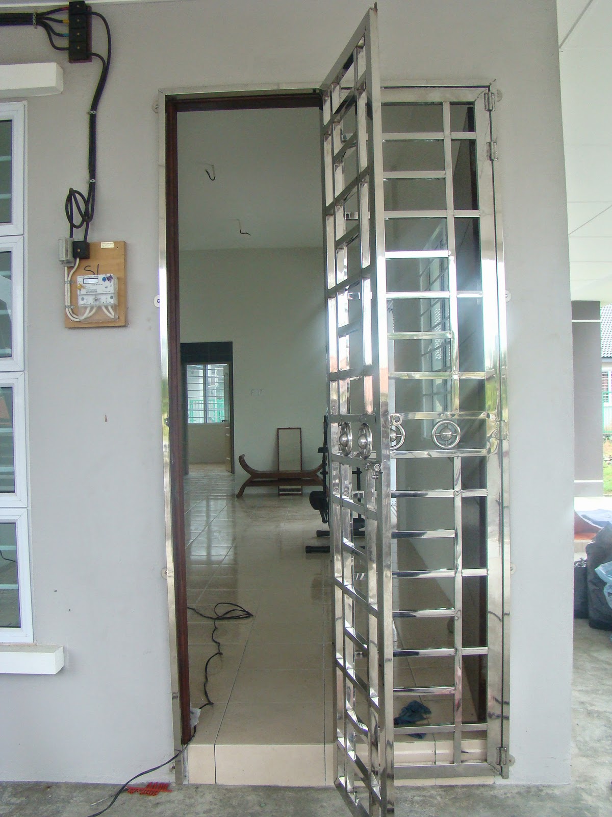 Design Grill Pintu Rumah - MosOp