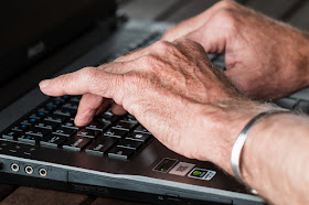 Old hands typing 