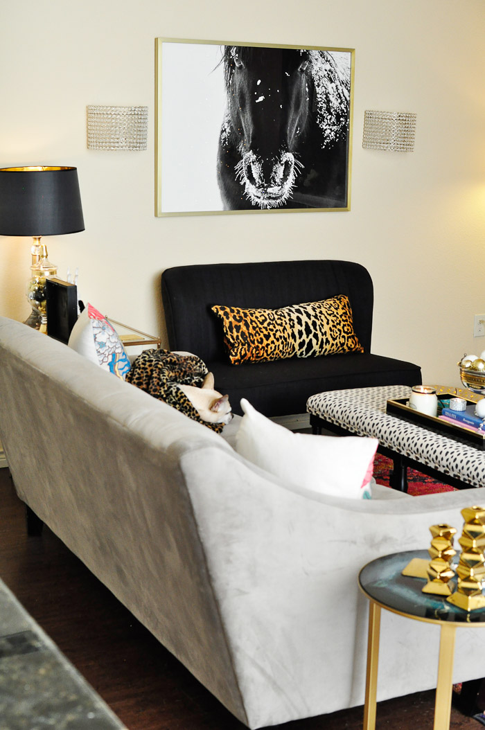 An eclectic holiday tour of a small apartment living and dining space decorated for Christmas! The black, white, gold and silver touches are gorgeous.