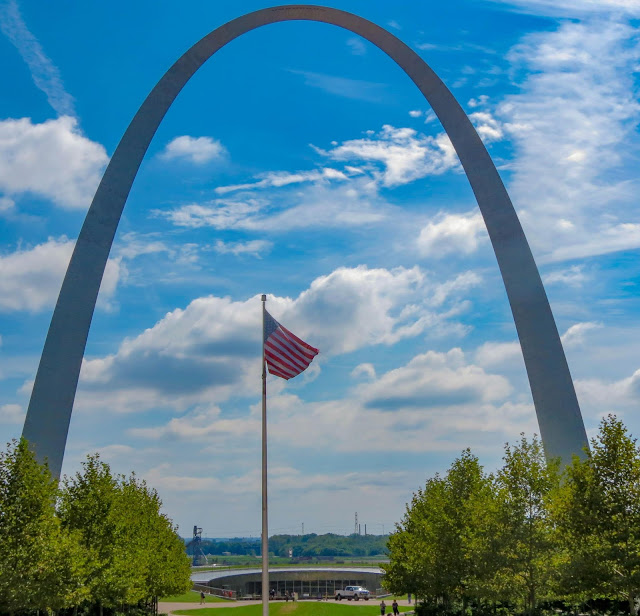 Gateway Arch with American flag in St Louis photo by mbgphoto