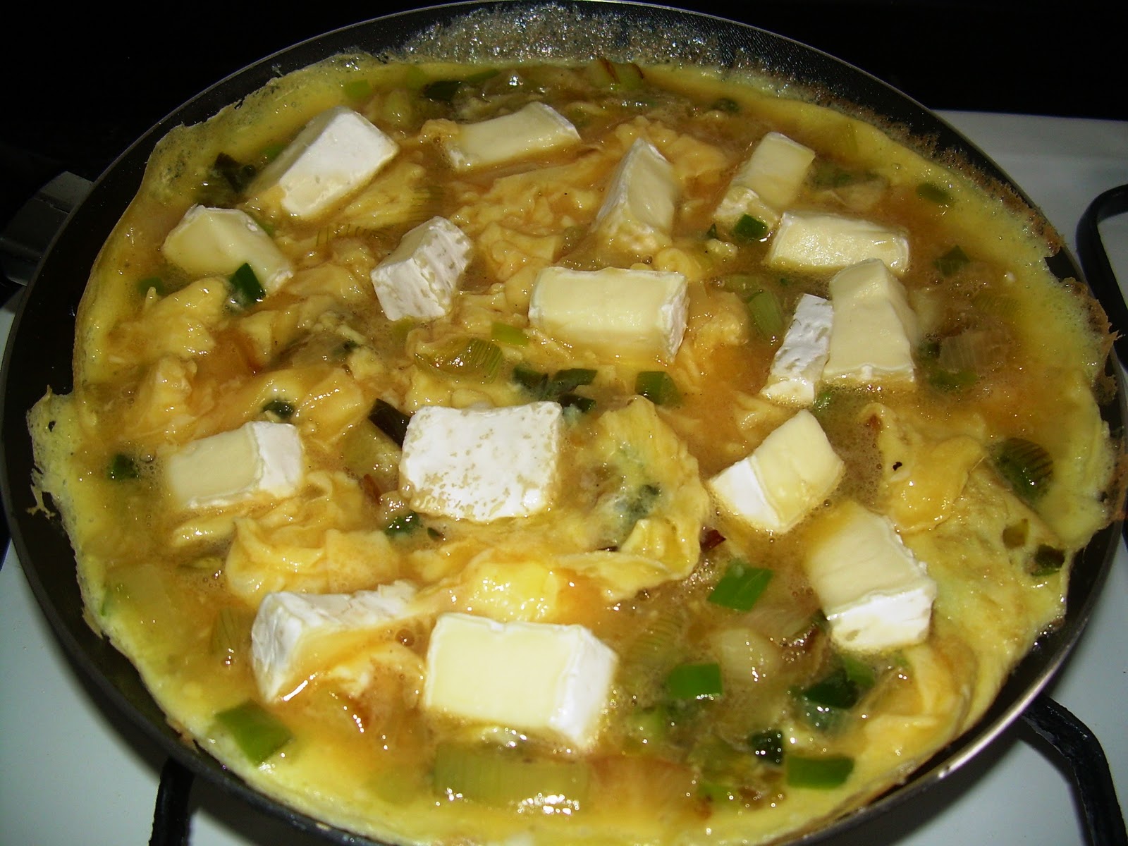 Gastronomicón Tortilla cremosa de calçots y queso brie