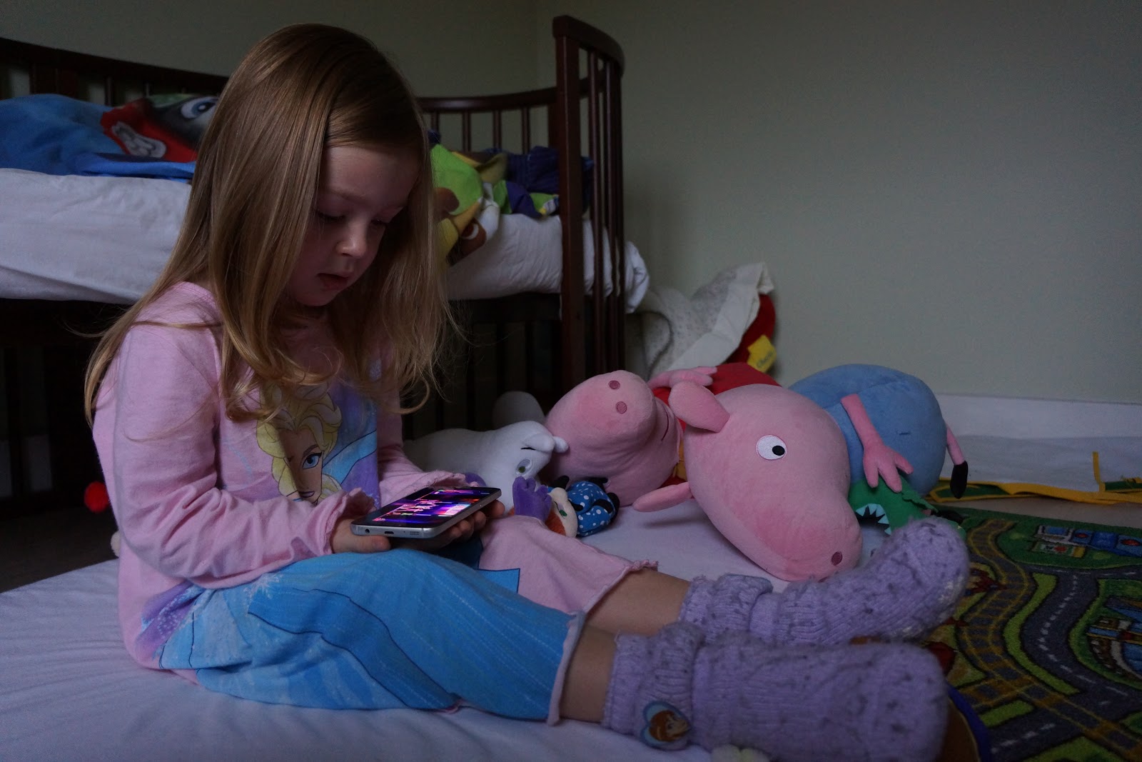toddler girl watching a film online on mobile