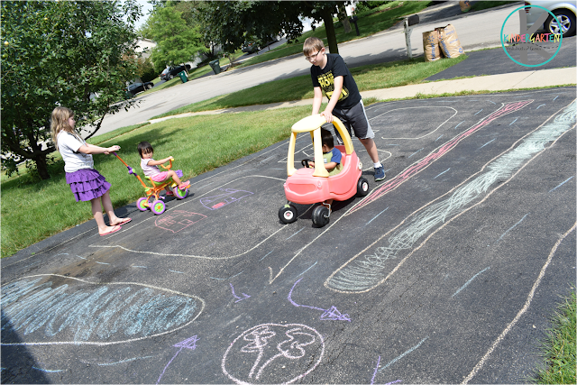 learn about road signs, roads and cars with this fun chalk on driveway kids activities learn about road signs, roads and cars with this fun chalk on driveway kids activities