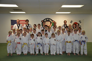 Students in a karate school doing karate lessons in Denver, CO