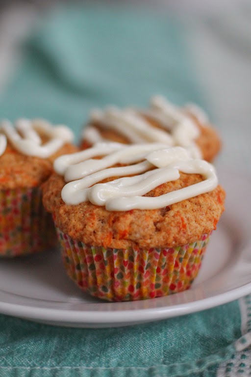 Food Lust People Love: hese delicious carrot muffins have all the flavor of tender carrot cake but are made with the two-bowl method traditional for muffins and are topped with generous lashing of sweetened cream cheese.