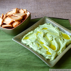 Avocado feta hummus is good as a stand alone dip--but it sings when you layer it with fresh & preserved vegetables and additional cheese then scoop it up with fresh veggies and pita chips.