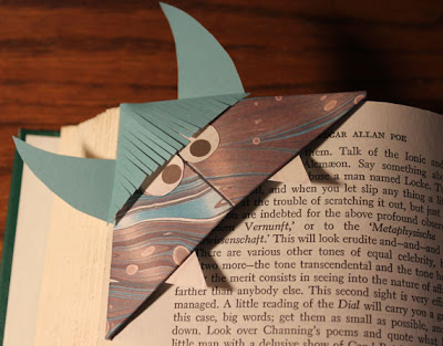 origami monster bookmark on an Edgar Allan Poe book