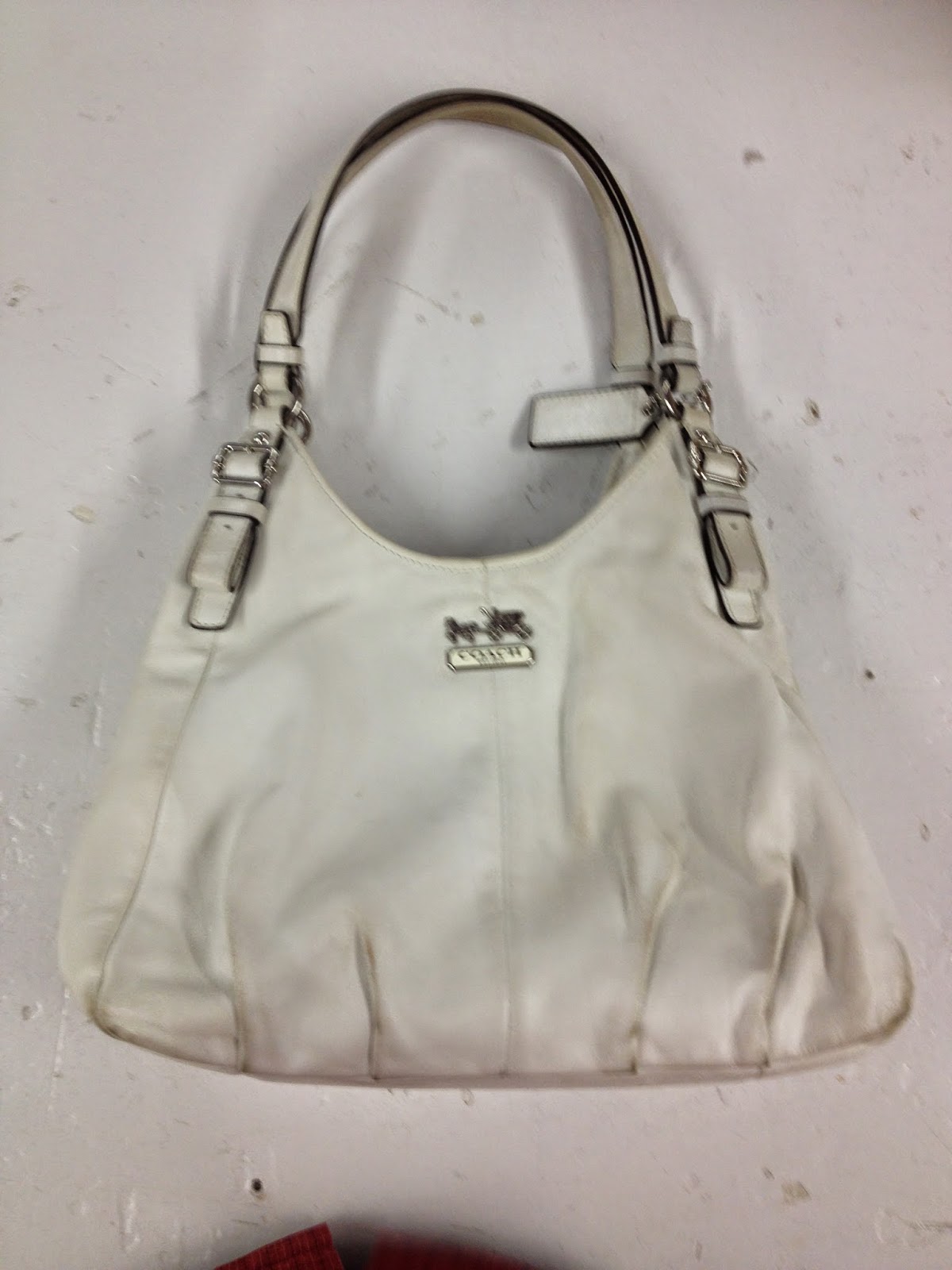 Leather Cleaning, Re-dyeing and Restoration: White Leather Coach Handbag Restored