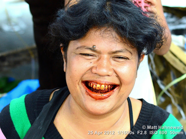 people, Batak woman, street portrait, Indonesia, Sumatra, Lake Toba, betel nut, betel quid, areca nut, sirih, paan, chewing tobacco, red coloured salivation, red stained teeth