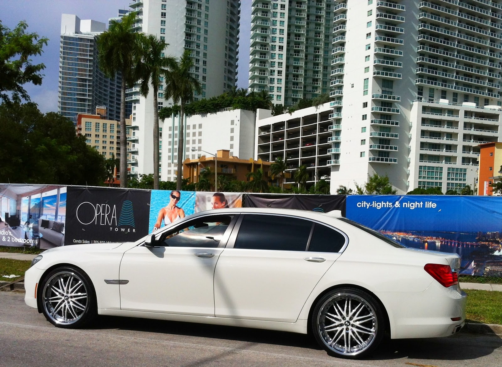White BMW 7 Series with custom white rims | Exotic Cars on the Streets