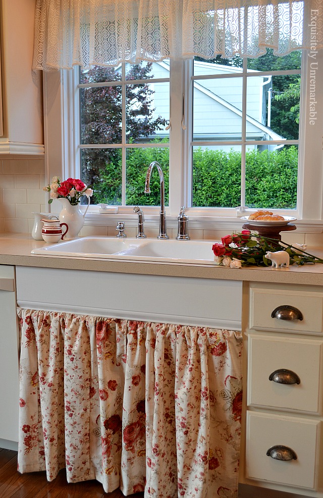 Kitchen sink with DIY floral skirt hanging below it